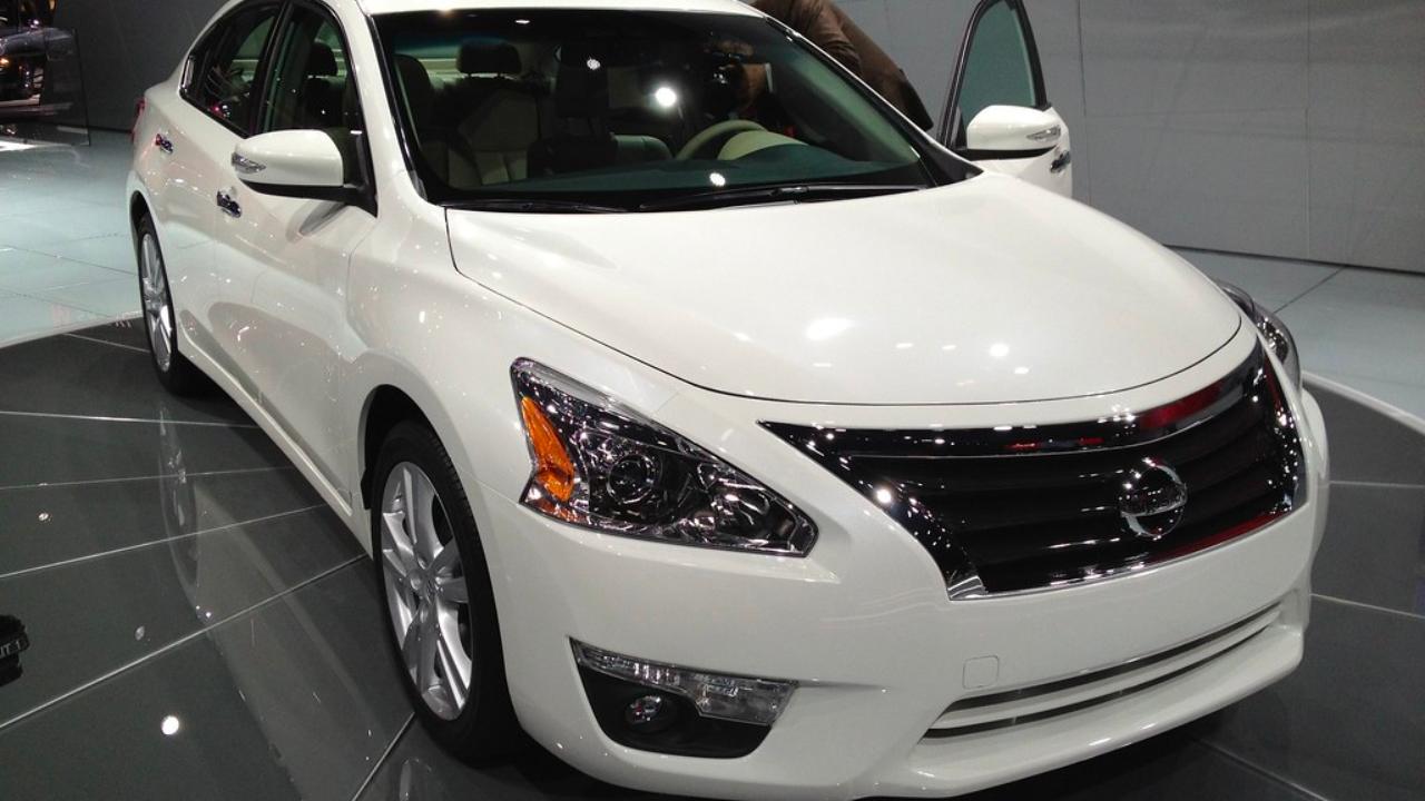Used Nissan Altima in a showroom showing why it is the top choice for reliability.